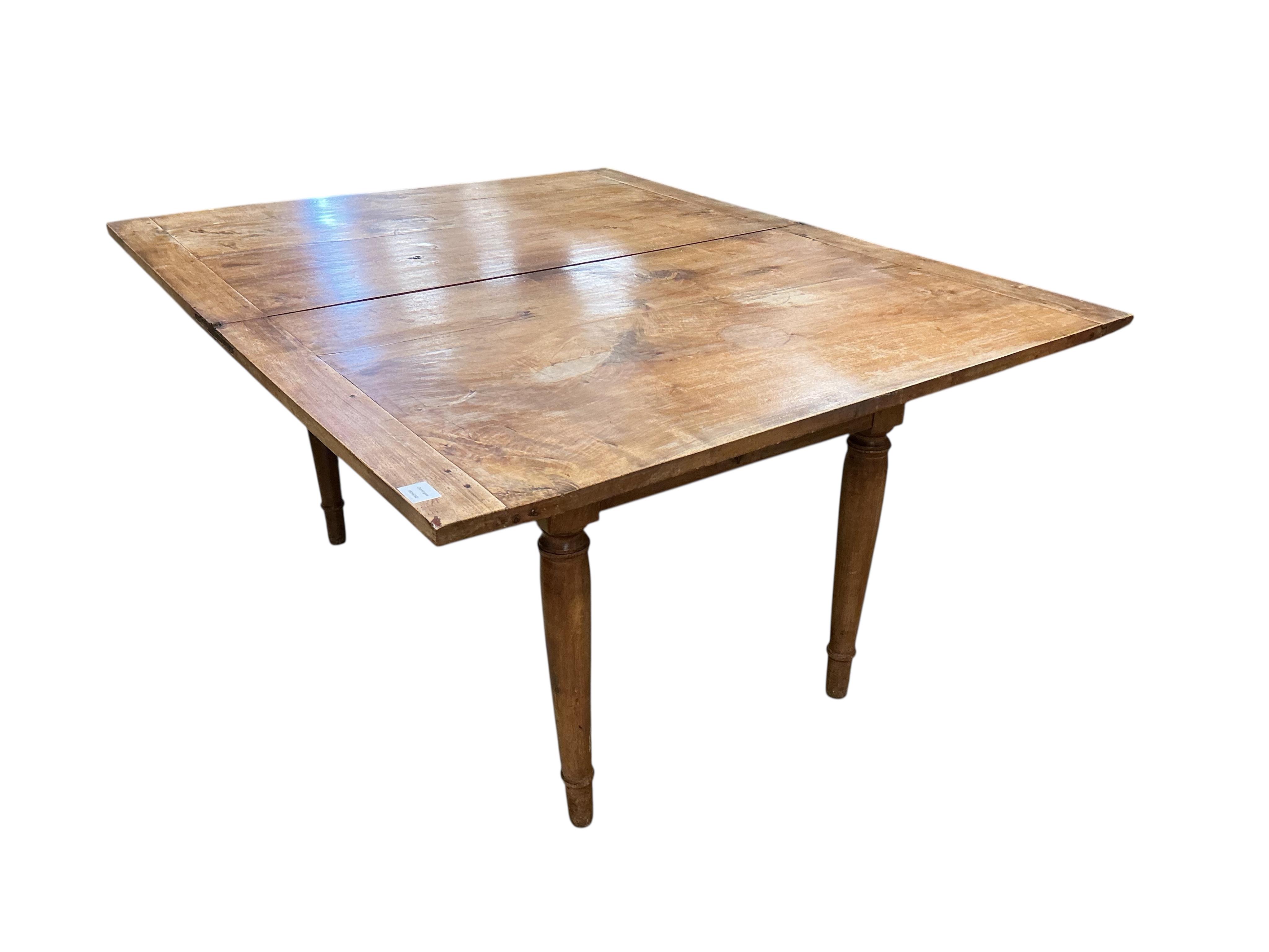 A 19th century French folding fruitwood kitchen table, width 117cm, depth 72cm, height 74cm